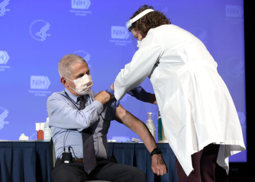 Dr. Anthony Fauci, Director of the National Institute of Allergy and Infectious Diseases, receives the Moderna COVID-19 vaccine at the HHS/NIH COVID-19 Vaccine Kick-Off event at NIH on 12/22/20. 