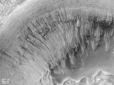 Close up of a crater wall showing gullies made by erosion